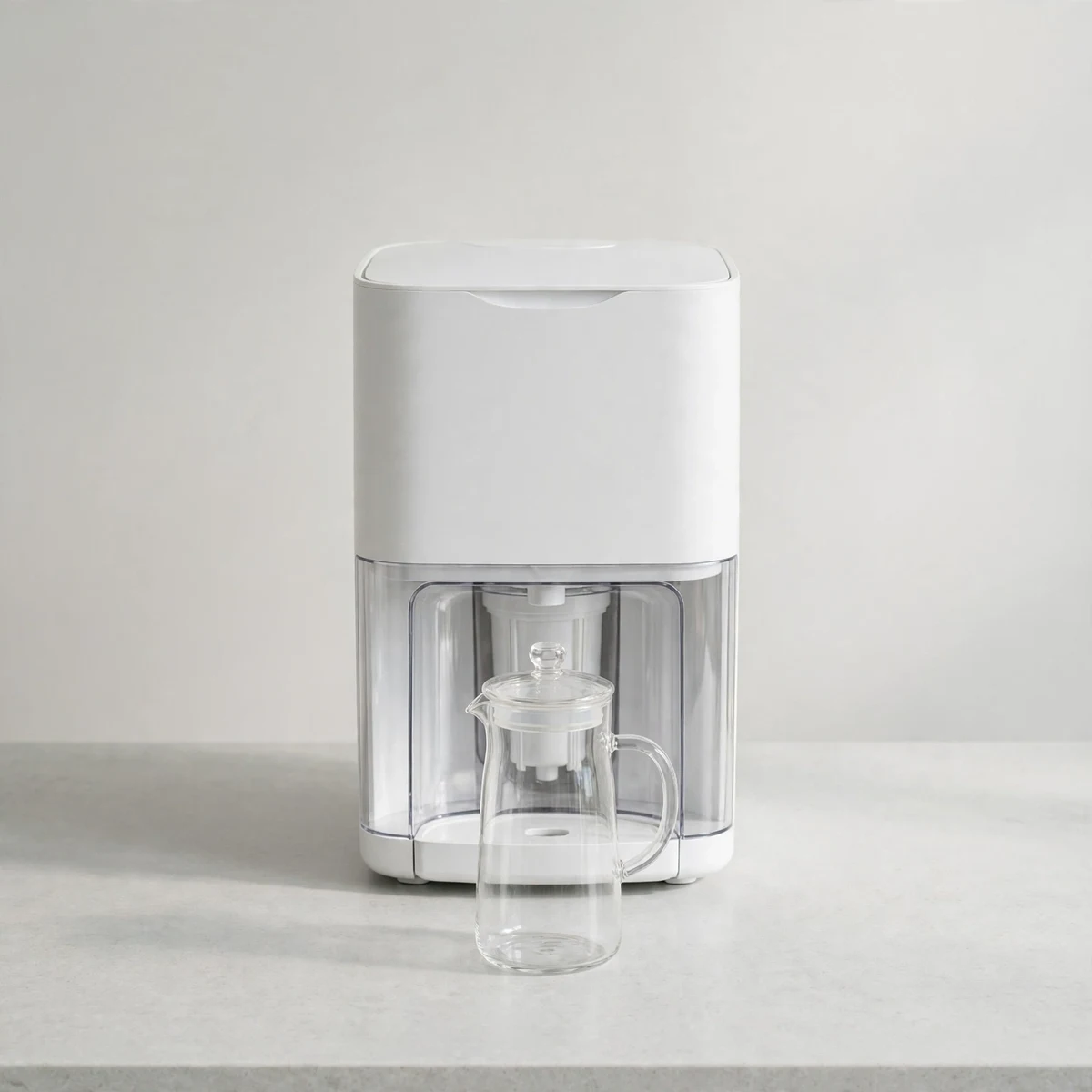 Bluevua ROPOT countertop reverse osmosis unit with glass carafe on a kitchen counter