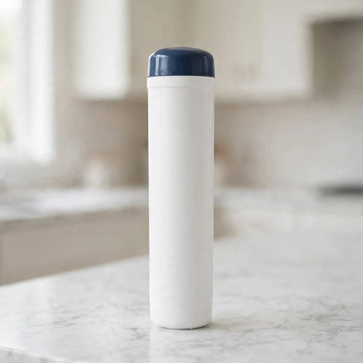 Brita Elite (OB06) tall white filter cartridge with a dark-blue cap on a marble counter
