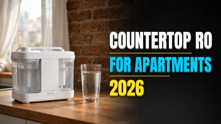 White countertop reverse-osmosis unit with twin water tanks on an apartment counter